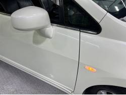 ティーダ アクシス（黒本革）の中古車画像