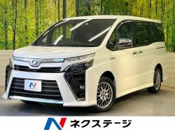 ヴォクシー ハイブリッドＺＳ　煌 フリップダウンモニター　セーフティセンス　純正９型ナビ　バックカメラ　フルセグ　クルーズコントロール　ＬＥＤヘッド＆フォグ　オートハイビーム　リアオートエアコン　スマートキー　ＥＴＣ　ドラレコの中古車画像