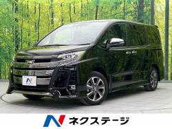 ノア Ｓｉ　ダブルバイビーＩＩＩ 純正９型ナビ　１２．１型フリップダウンモニター　両側電動スライドドア　衝突軽減装置　禁煙車　バックカメラ　ＥＴＣ　Ｂｌｕｅｔｏｏｔｈ　フルセグ　ドライブレコーダー　ハーフレザーシート　ＬＥＤヘッドの中古車画像