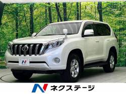 ランドクルーザープラド ＴＸ ４ＷＤ　純正ナビ　ＥＴＣ　バックカメラ　ＬＥＤヘッド　リアフォグ　オートライト　デュアルエアコン　電動リアデフロック　ヘッドランプクリーナー　サイドステップ　スマートエントリー　ベージュ色シートカバーの中古車画像